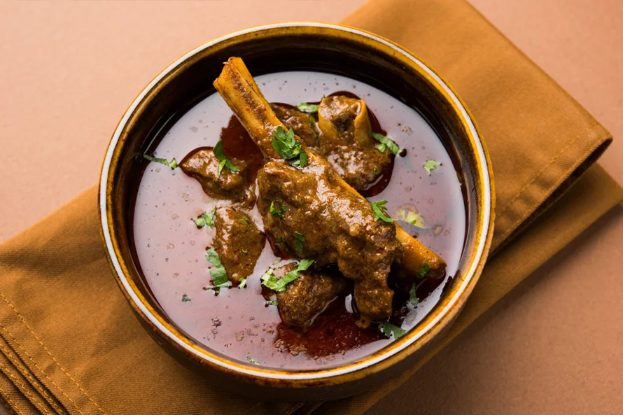 Spicy lamb karahi curry cooked with peppers, and fresh coriander