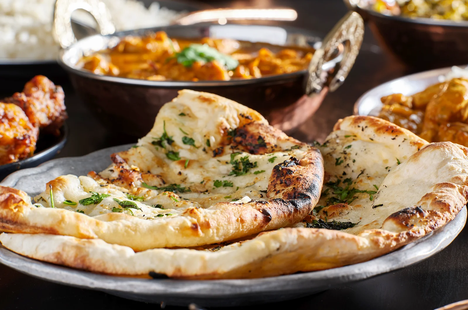 fluffy Tandoori Naan served on a plate